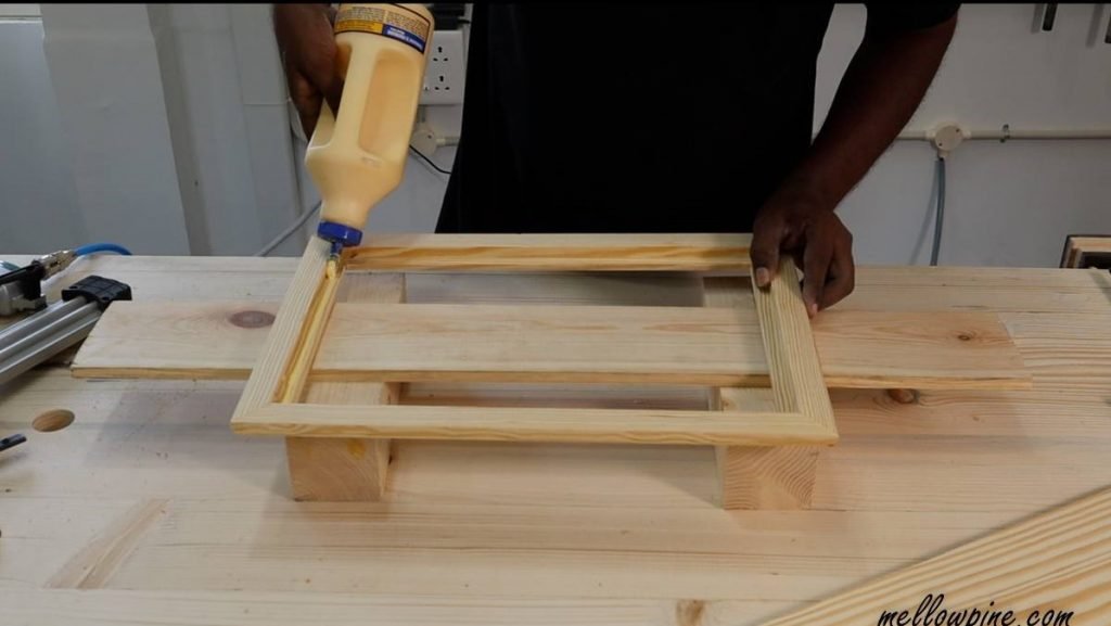 gluing the board onto the frame