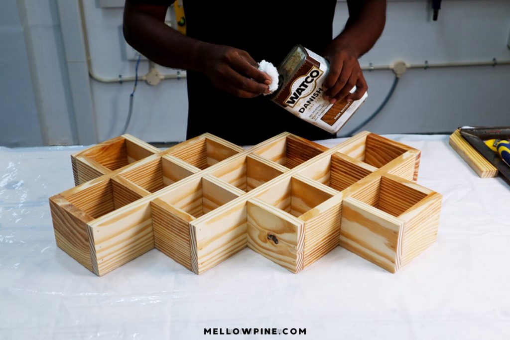 applying danish oil on spice rack