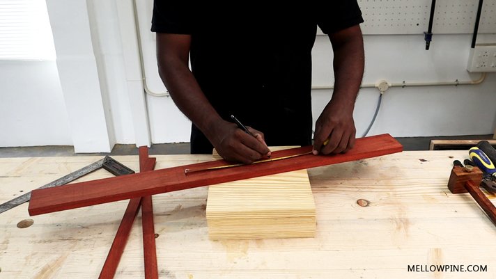 marking the shelf locations on the vertical spine column