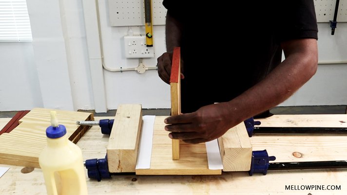glue up of the shelves and lining with paper pieces between each shelf
