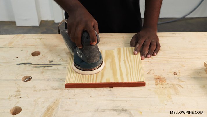 sanding the wood pieces