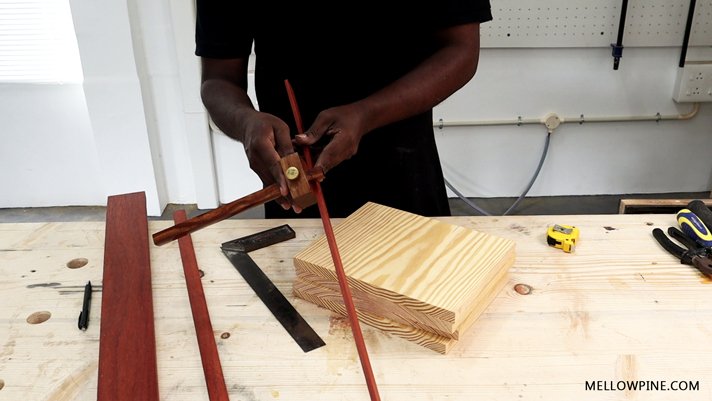 Setting the width on the marking gauge from the padauk lining piece