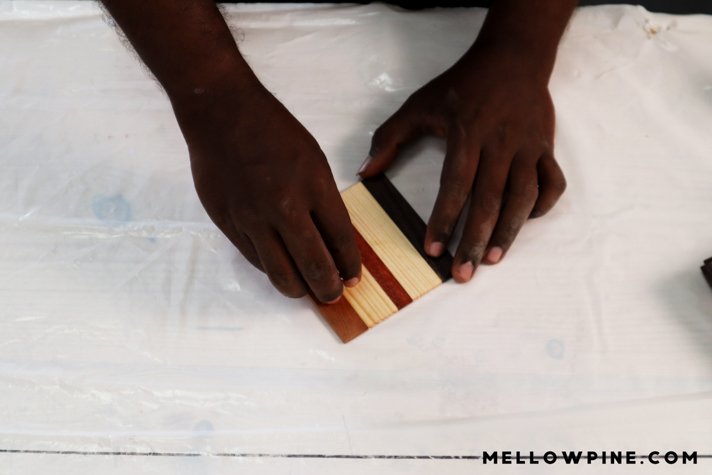 applying paste wax to coasters