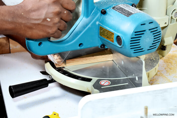 Cutting the triangular piece on the miter saw