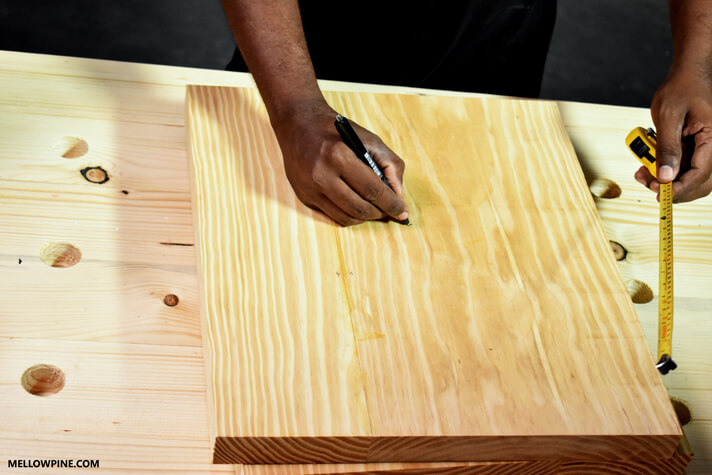 Marking the center of the leg piece for cutting the circular hole