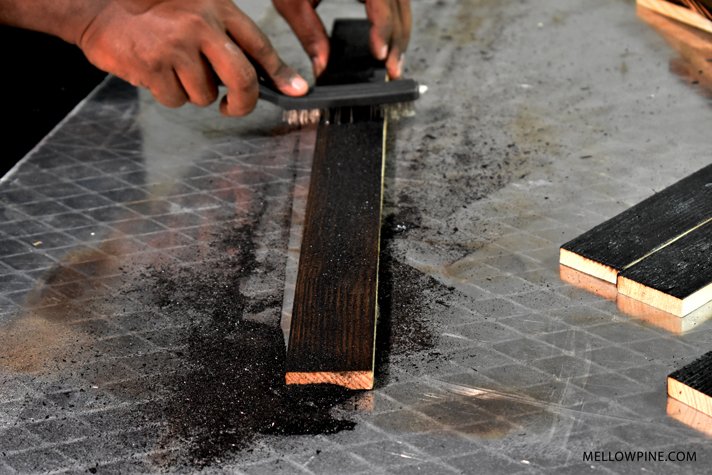 wire brush on burned wood