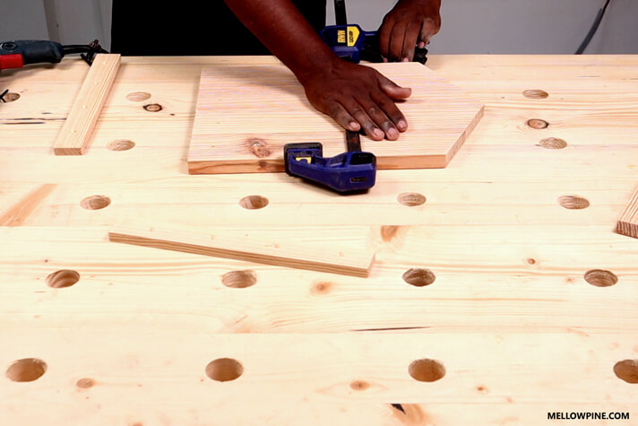 Temporarily clamping the base pieces for fixing the bracing pieces at the back