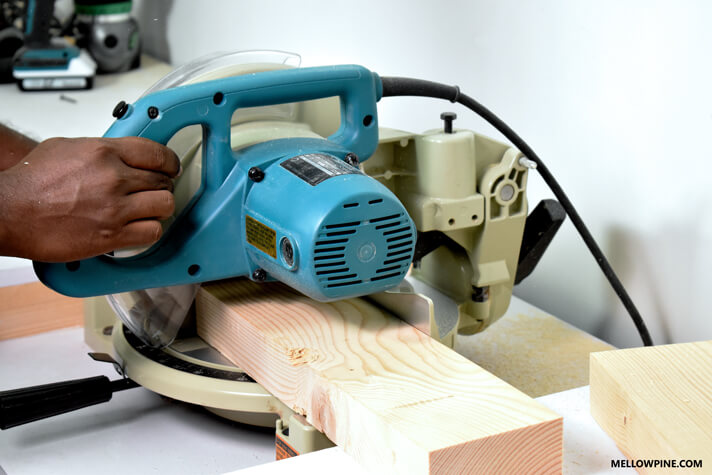 Cutting the support pieces for the legs of the bench