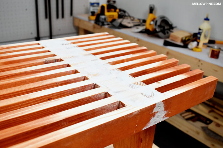 Applying wood filler on the screw holes