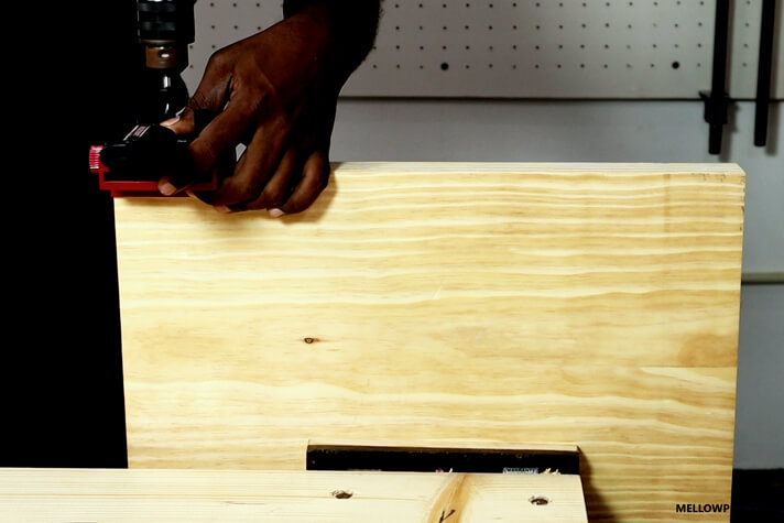 Making the dowel hole on the board for the leg