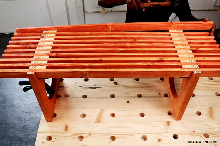 Fitting the slats into the box joint in the legs
