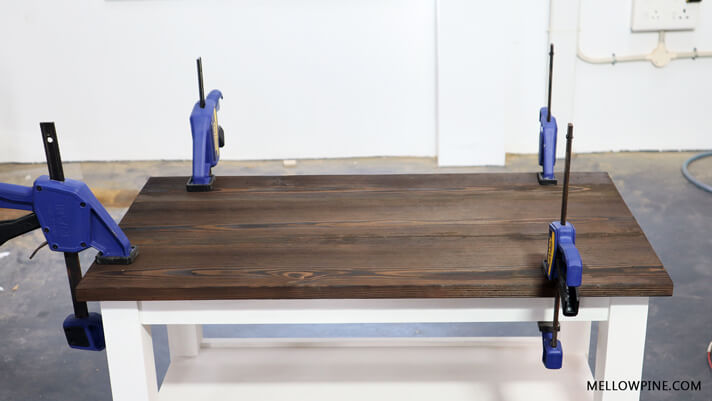 Clamped the table top to the frame until glue cured