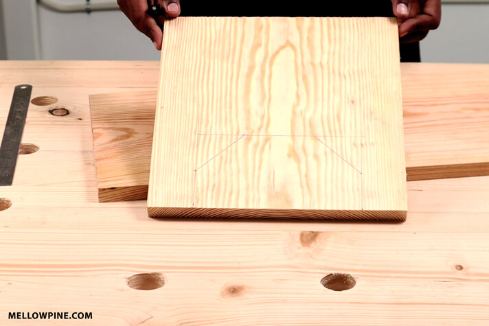 Marking the lines for cutting the slot in the legs of the stool