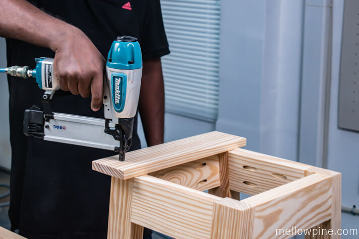 Fixing the top seating piece to the frame using nail