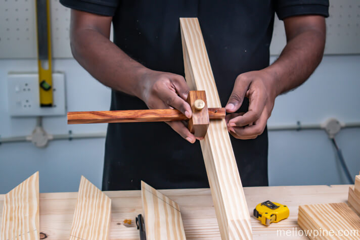 Marking ¾" depth in the bracing piece using marking gauge