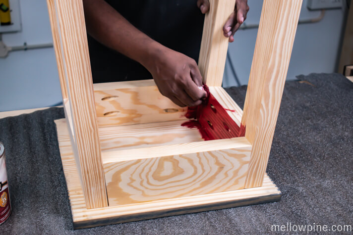 Staining the top of the frame with barn red stain
