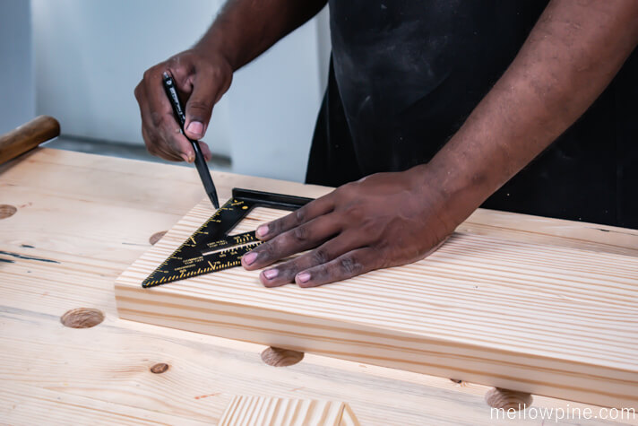Marking the location to fix the leg frame on the base