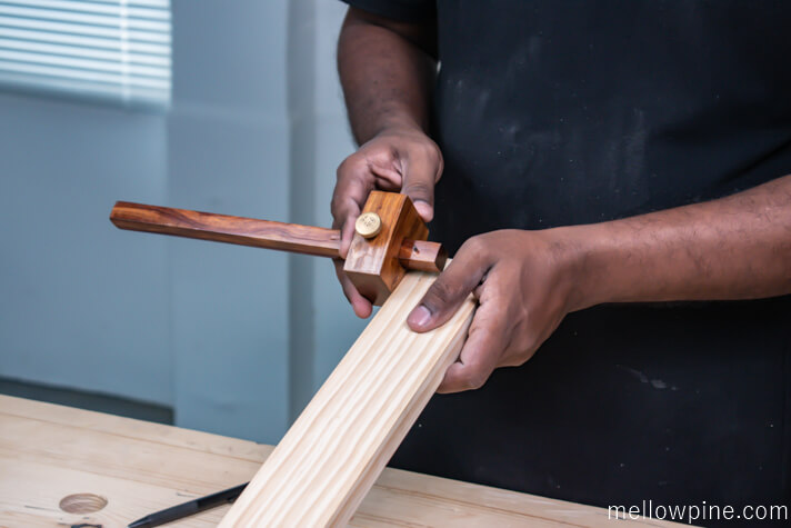Marking the shape of the dovetail on the bottom bracing piece