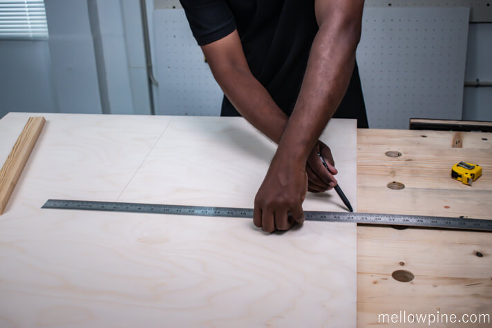 Measuring the plywood base for the wall art