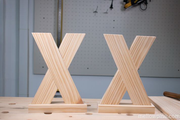 X brace piece joined to the base piece to make two leg pieces
