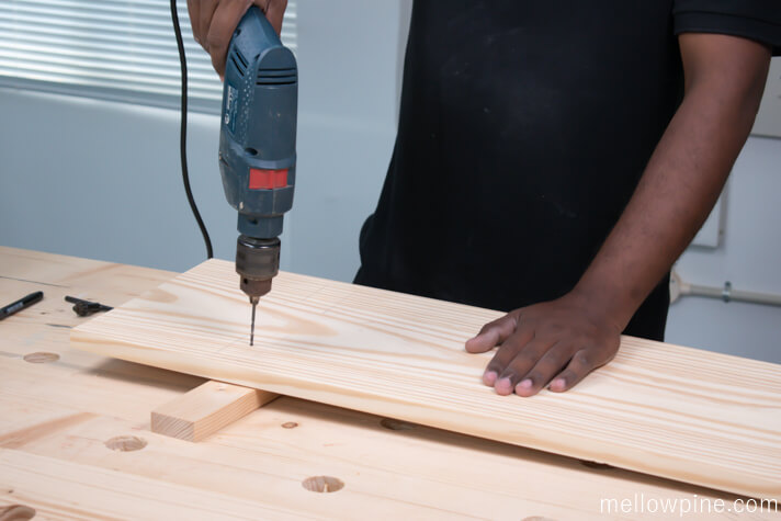 Drilling the pilot hole for joining the top piece to the leg piece