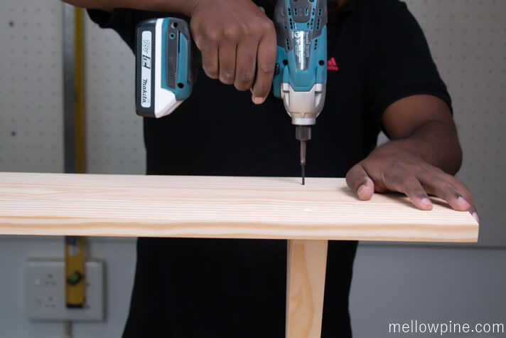 Screwing the top piece to the leg piece