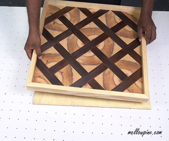 fixing the wall art to the plywood base