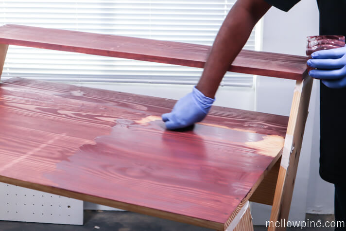 Applying barn red stain