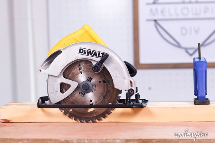 The blade of the circular saw should touch the sacrificial sheet