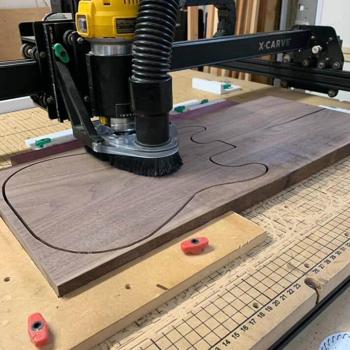 X Carve CNC working on hardwood