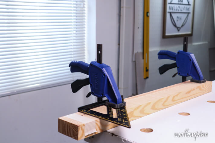 clamping the speed square on the wood