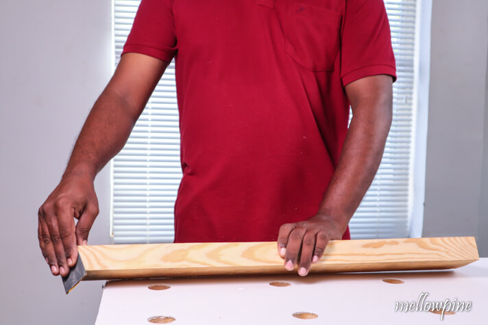 sanding the wood for finishing