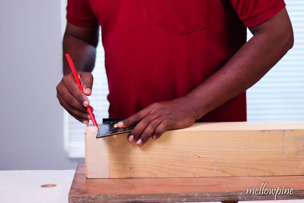Marking side using carpenters pencil and speed square