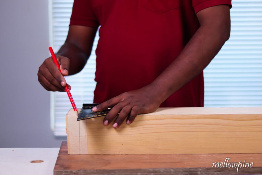 Marking the line using speed square and pencil