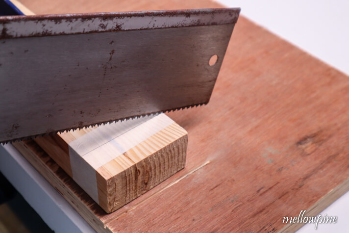Placing the handsaw on the cut line