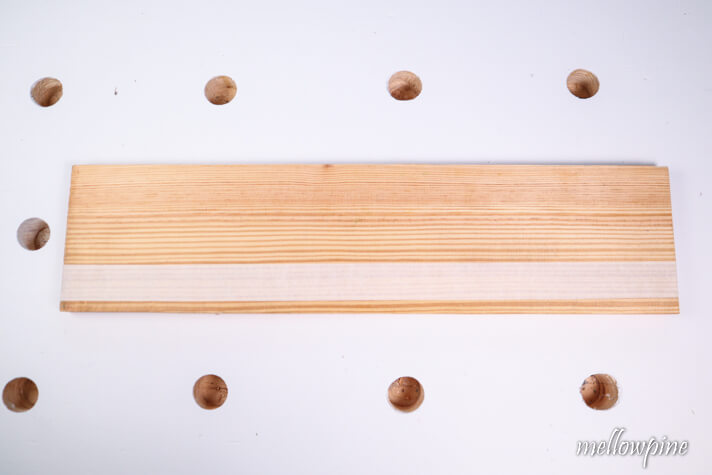 fixing masking tape on the wood