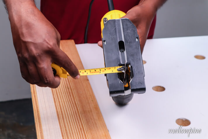 measuring the offset from the blade to the edge of the base plate