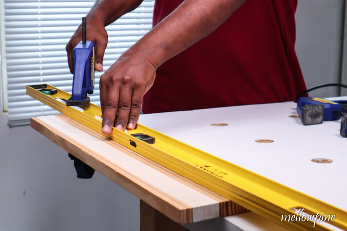clamping a level to the wood as straight edge