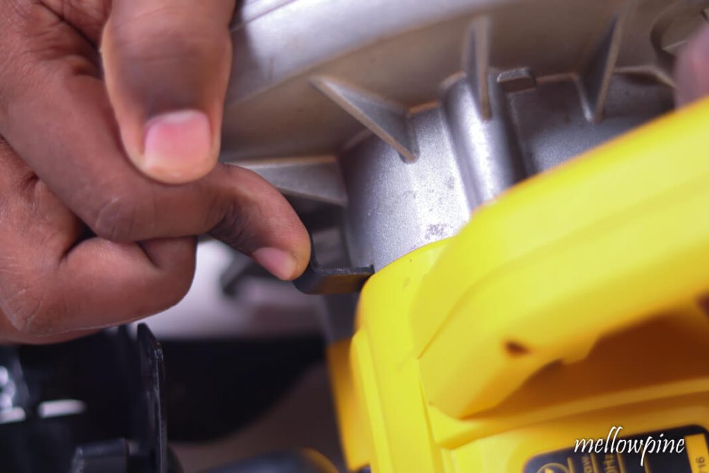Pressing arbor lock button