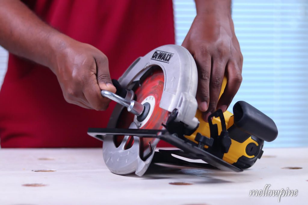 Loosening the bolt using blade wrench