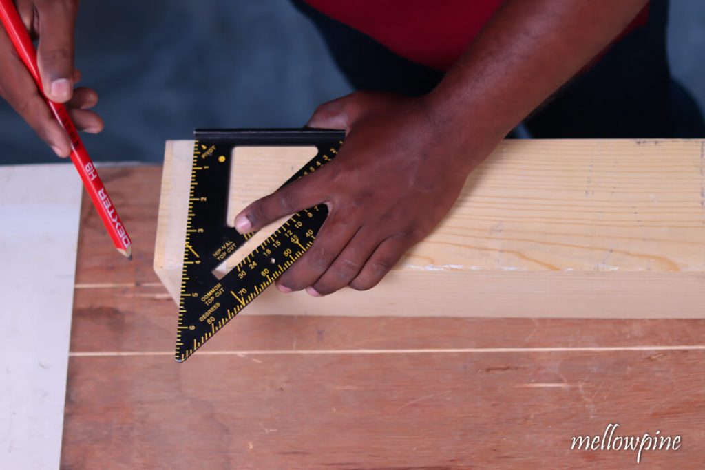Marking side using carpenters pencil and speed square