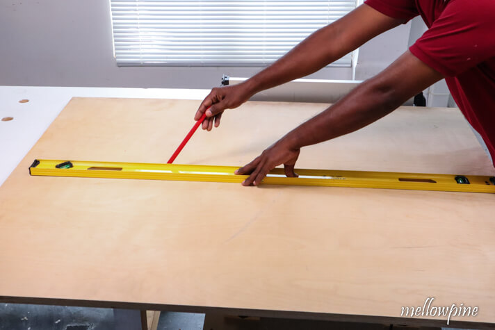 marking the line of ripping using a level