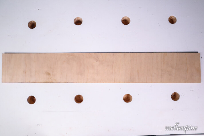 scrap piece of plywood with at least one edge straight