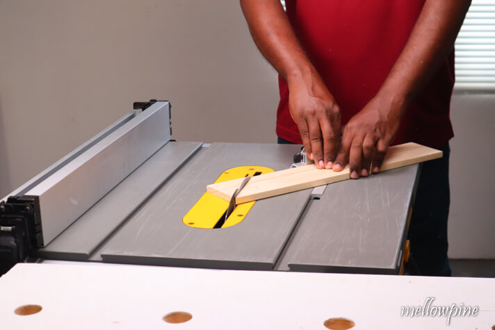 making a 45 degree miter cut on the scrap wood piece