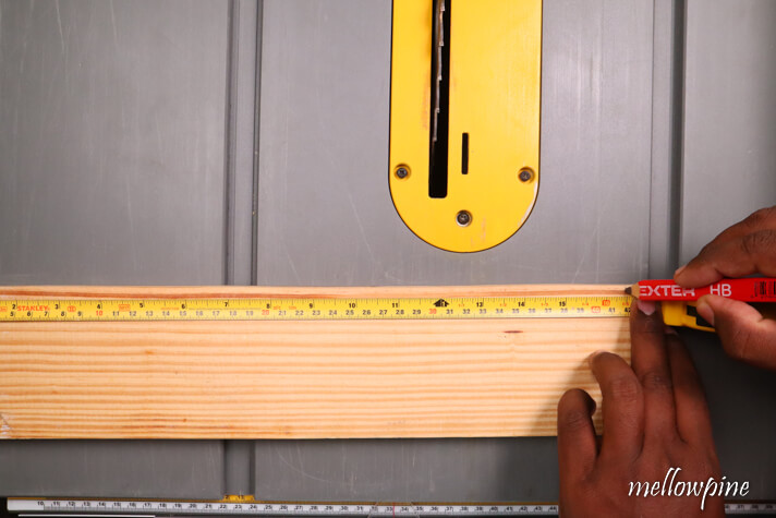 Marking the point of cut on the wood