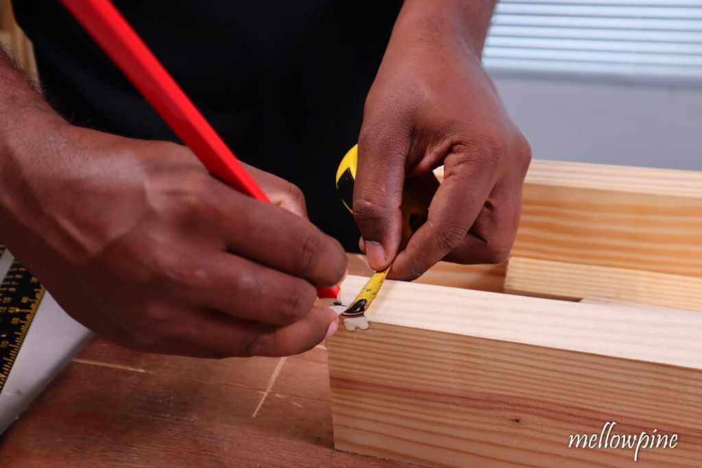 Marking the rabbet cut dimensions on the wood at both ends
