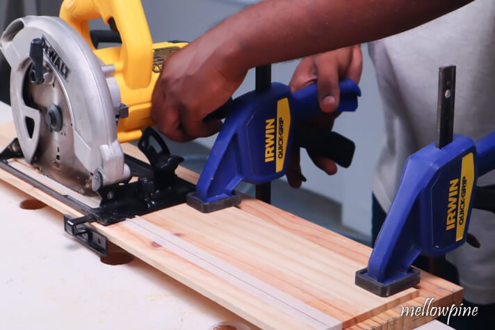 Taking off the clamp blocking the circular saw
