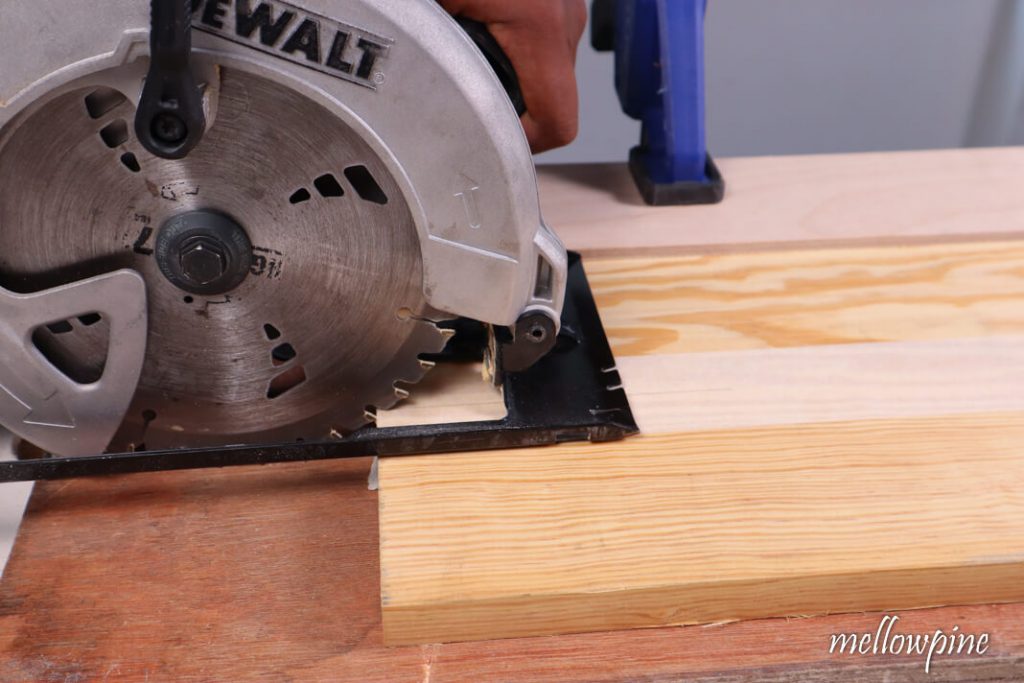 Aligning the blade with cut line using plywood as guide