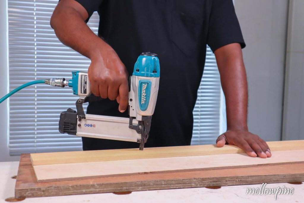 Nailing the plywood with plank