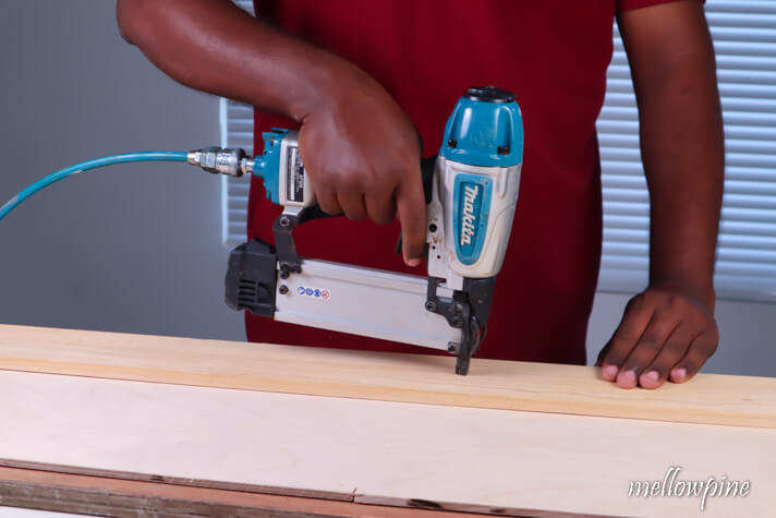 Nailing the plywood with plank